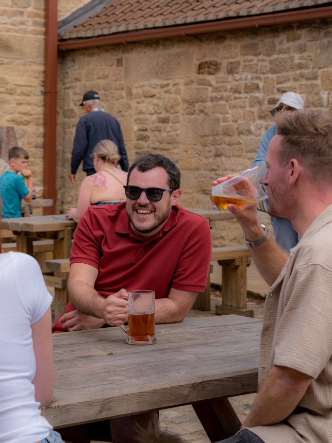 Spacers enjoying a drink together at a team social